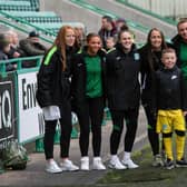 The Hibs Women's squad takes a picture with a fan during a Hibs open training session with season ticket holders at Easter Road on May 02, 2022. (Photo by Paul Devlin / SNS Group)