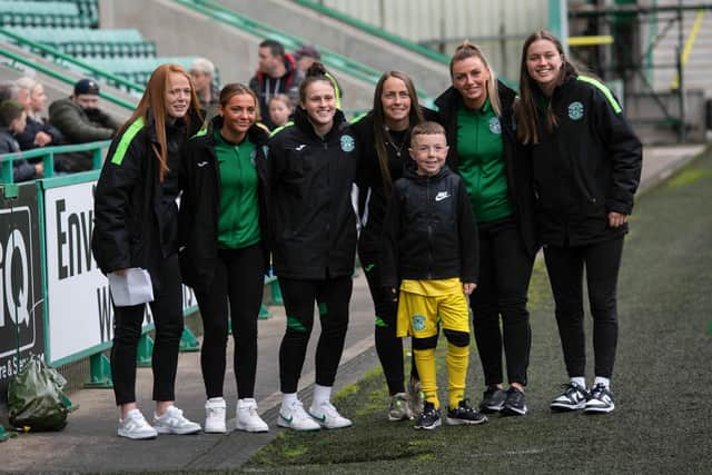 The Hibs Women's squad takes a picture with a fan during a Hibs open training session with season ticket holders at Easter Road on May 02, 2022. (Photo by Paul Devlin / SNS Group)