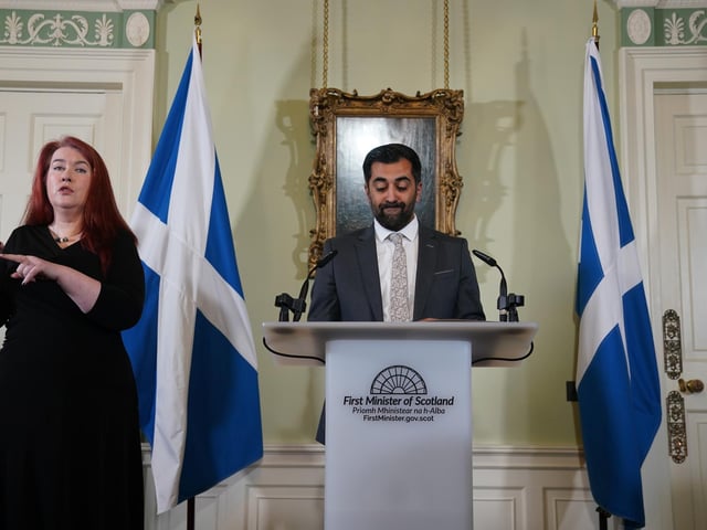 Humza Yousaf speaks during a press conference at Bute House, his official residence in Edinburgh where he said he will resign as SNP leader and Scotland's First Minister. Mr Yousaf, pictured here alongside a sign language interpreter, resigned from office today ahead of a confidence vote he was expected to lose after the coalition with the Scottish Green Party was scrapped last week. Picture: Andrew Milligan-Pool/Getty Images