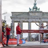 Eilish McColgan crosses the finish line of the Half Marathon in Berlin, Germany, Sunday April 2, 2023. (Andreas Gora/dpa via AP)
