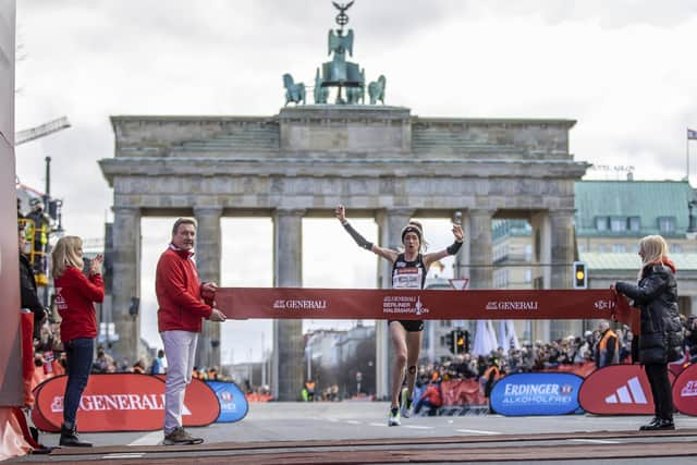 Eilish McColgan crosses the finish line of the Half Marathon in Berlin, Germany, Sunday April 2, 2023. (Andreas Gora/dpa via AP)