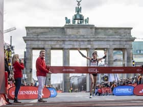 Eilish McColgan crosses the finish line of the Half Marathon in Berlin, Germany, Sunday April 2, 2023. (Andreas Gora/dpa via AP)