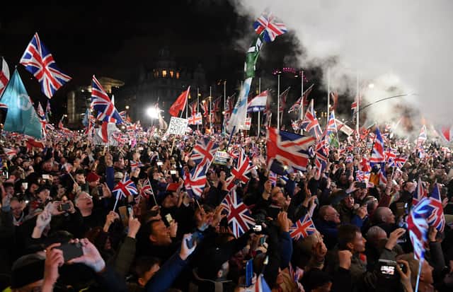 Brexit supporters wave Union flags on the day the UK formally left the European Union (Picture: Daniel Leal-Olivas/AFP via Getty Images)