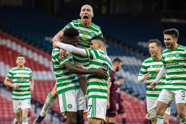 Celtic's Odsonne Edouard (left) celebrates with Scott Brown (centre) and Mohamed Elyounoussi during the William Hill Scottish Cup Final between Celtic and Hearts at Hampden Park, on December 20, 2020, in Glasgow, Scotland. (Photo by Craig Williamson / SNS Group)