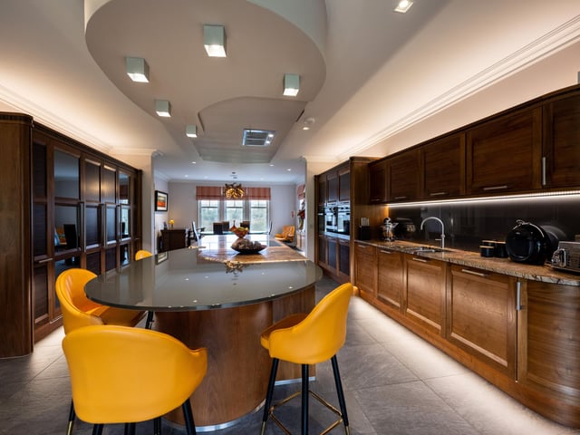 Interior: A grand entrance hall leads to the home’s sleek open-plan kitchen-dining space. A family room features French doors, and there is a cosy snug. Downstairs also has a garage, utility room, office and lounge. Upstairs, are three ensuite bedrooms, a cinema, family bathroom by Laings of Inverurie, and two smaller bedrooms.
