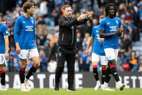 Rangers manager Michael Beale speaks with Sam Lammers and Johnly Yfeko during the 2-1 win over Hamburg.
