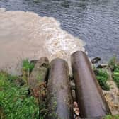 Heavily silted liquid poured into the Dee, turning the normally clear water a dirty brown colour.