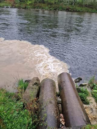 Heavily silted liquid poured into the Dee, turning the normally clear water a dirty brown colour.