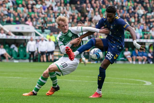 Hibs' Ewan Henderson and Kilmarnock's Ryan Alebiosu tussle for possession during Hibs' 1-0 win over Kilmarnock.