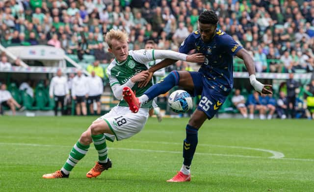 Hibs' Ewan Henderson and Kilmarnock's Ryan Alebiosu tussle for possession during Hibs' 1-0 win over Kilmarnock.