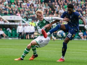 Hibs' Ewan Henderson and Kilmarnock's Ryan Alebiosu tussle for possession during Hibs' 1-0 win over Kilmarnock.