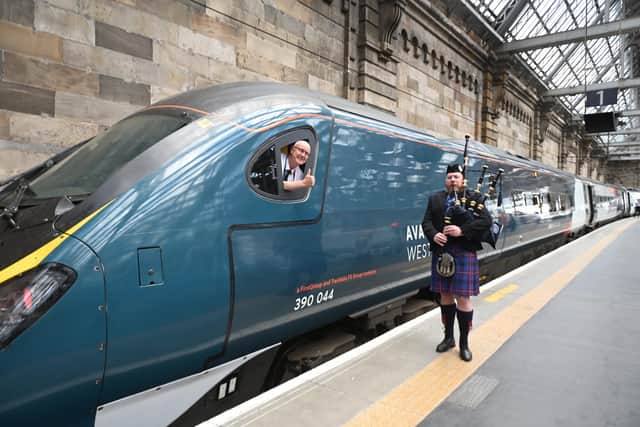 A piper welcoming the record-breaking attempt as the train arrived at Glasgow Central. Picture: John Devlin