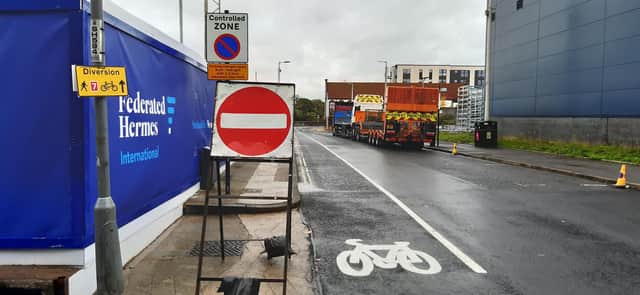 Contradictory signs on the cycle diversion route at West Greenhill Place, off Finnieston Street. Picture: The Scotsman