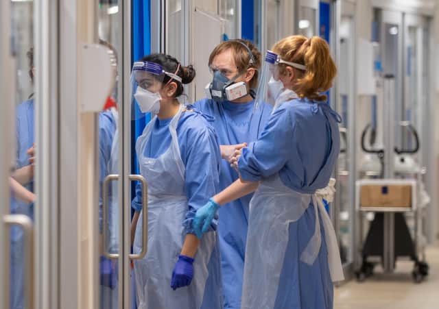 Staff check on patients suffering with Covid-19 on the critical care unit at the Royal Papworth Hospital, Cambridge picture: PA