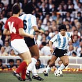 Argentina player Diego Maradona (c) takes on the Belguim defence during the 1982 FIFA World Cup match between Argentina and Belguim at the Nou Camp stadium on June 13, 1982 in Barcelona, Spain.