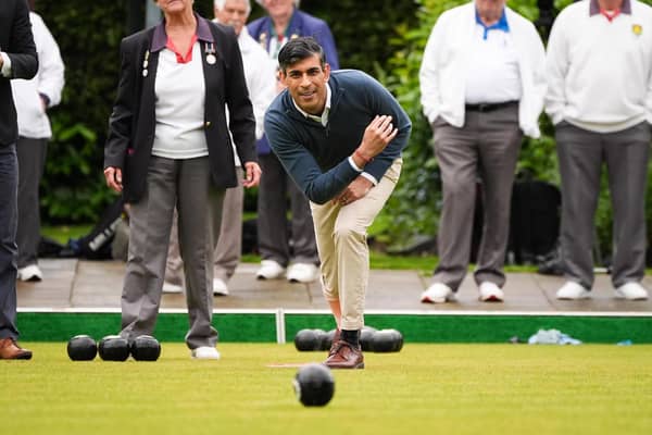 Prime Minister Rishi Sunak plays a game of bowls during a visit to Market Bosworth Bowling Club, where he is seeking to woo pensioners.