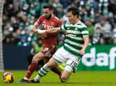 In being referred to as 'big Oh' by his manager Ange Postecoglou,  Celtic striker Oh Hyeon-gyu - seen here being tackled by Aberdeen's Graeme Shinnie -  maybe should consider taking to the pitch is shades. (Photo by Craig Williamson / SNS Group)