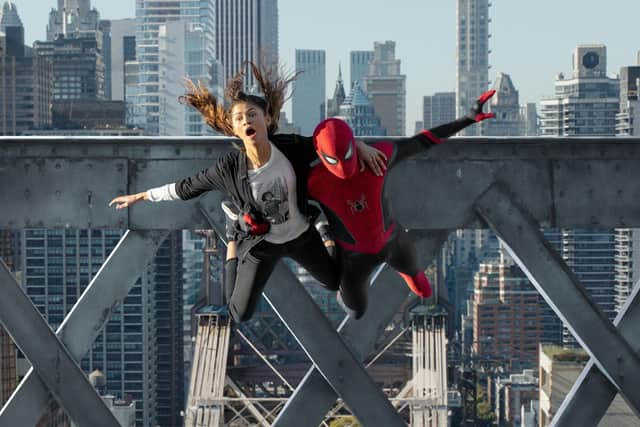 MJ (Zendaya) and Spider-Man (Tom Holland) jump off the bridge in Spider-Man: No Way Home. Photo: PA Photo/©2021 CTMG.