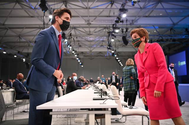 Canadian Prime Minister Justin Trudeau and Scotland's First Minister Nicola Sturgeon at the opening ceremony of the UN Climate Change Conference COP26  in Glasgow.  (Photo by Jeff J Mitchell/Getty Images)