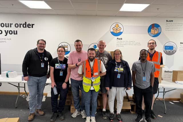 The Amazon Dunfermline team packed 1,500 backpacks for The Big House Multibank