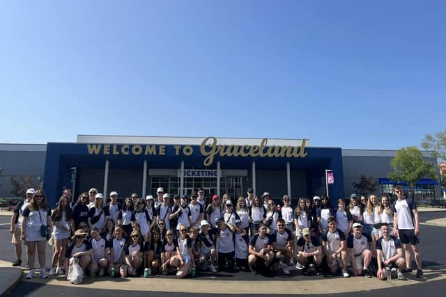 Members of the Ayrshire Fiddle Orchestra outside the entrance to Graceland, Elvis Presley's former home, where they performed to visitors (pic: Ayrshire Fiddle Orchestra)