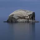 The tall ship Pelican of London is anchored alongside the Bass Rock off the East Lothian coast during a tour around the coast of Britain.