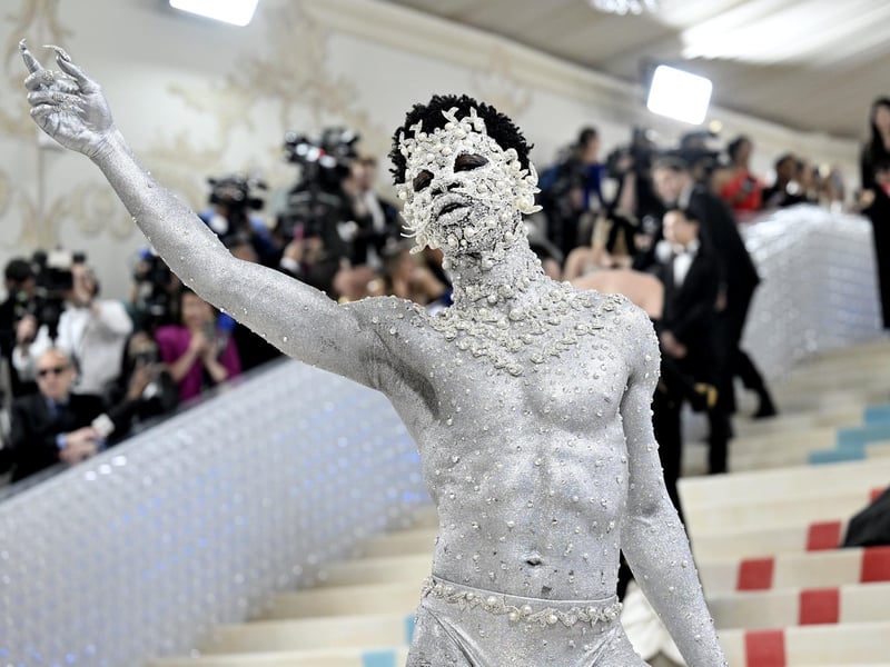 Lil Nas X spent 9 hours becoming a sparkling cat - in another look inspired by Lagerfeld's pet - by celebrity make-up artist Pat McGrath.