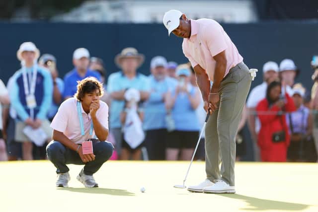 Three-time winner Tiger Woods putts as son Charlie looks on during a practice round prior to the US Open at Pinehurst Resort in North Carolina. Picture: Andrew Redington/Getty Images.