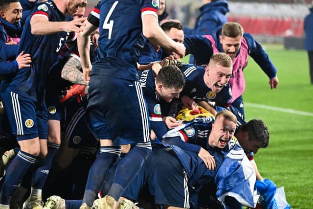 Scotland's players celebrate after winning the Euro 2020 play-off qualification football match between Serbia and Scotland at the Red Star Stadium in Belgrade on November 12, 2020. Photo by ANDREJ ISAKOVIC/AFP via Getty Images