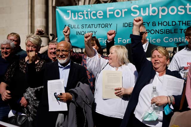 Former subpostmasters celebrate outside the Royal Courts of Justice in London, on April 23, 2021, following a court ruling clearing subpostmasters of convictions for theft and false accounting. - Dozens of former subpostmasters, who were convicted of theft, fraud and false accounting because of the Post Office's defective Horizon accounting system, have finally had their names cleared by the Court of Appeal. (Photo by Tolga Akmen / Getty Images)