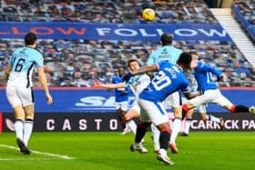 Ryan Kent heads Rangers into an early lead against Ross County at Ibrox. (Photo by Rob Casey / SNS Group)