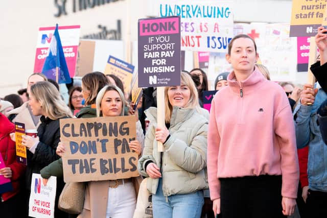 Members of the Royal College of Nursing (RCN) on the picket line outside St Thomas' Hospital, central London, as nurses in England, Wales and Northern Ireland take industrial action over pay. Picture date: Tuesday December 20, 2022.