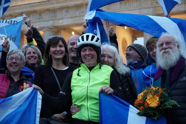 Jenny Graham with friends, family and supporters at Berlin's Brandenburg Gate, where she started and finished her round the world cycle. Pic: Contributed