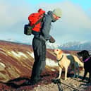 Sports commentator, author and 'Food Source' Andrew Cotter with Olive and Mabel in the Cairngorms. The trio are due to appear at this year's Boswell Book Festival and the Borders Book Festival and his latest book, Dog Days: A Year with Olive & Mabel, is out now. Pic: Nick Hanson