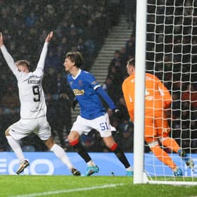 Livingston wanted a penalty at Ibrox for a potential handball incident.