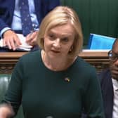 Prime Minister Liz Truss, expected to reveal details of the support package this week, speaks in the House of Commons alongside Chancellor Kwasi Kwarteng
