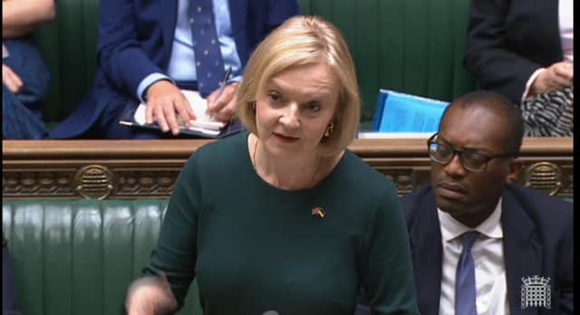 Prime Minister Liz Truss, expected to reveal details of the support package this week, speaks in the House of Commons alongside Chancellor Kwasi Kwarteng