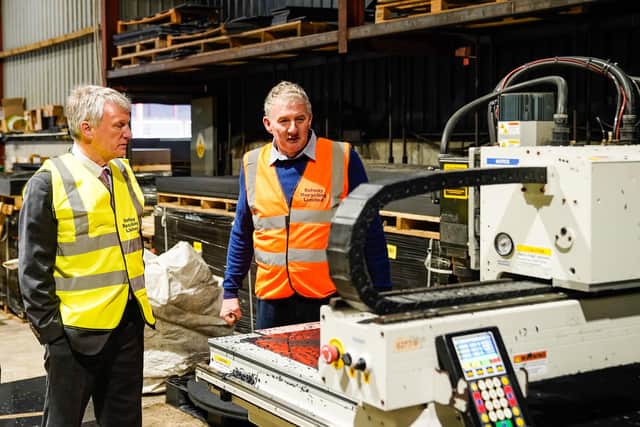 From left: Business Minister Ivan McKee and Solway Recycling boss Roy Hiddleston at the firm's Dumfries facility. Picture: Graham Edwards.