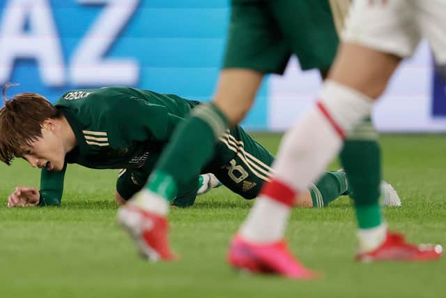 Celtic's Kyogo Furuhashi is left in agony after another robust challenge in the Alkmaar encounter. His manager says referees must deal with the "treatment" being meted out to him "on face value" to ensure the in-form Japanese striker is allowed to deliver on his talents. (Photo by Rico Brouwer / SNS Group)