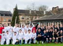 Scotland goalkeeper Craig Gordon poses with children from Hyndland Primary School - and clutches an old-style ball - at an event to mark the 150th anniversary of the first Scotland v England international fixture in 1872 at the West of Scotland Cricket Ground (Photo by Ross Parker / SNS Group)