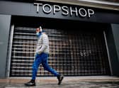 Asos has now bought over the Topshop brand,  but this has not saved high street stores from closing down   (Picture: AFP/Getty Images)