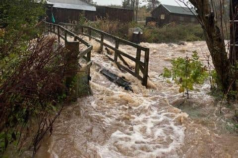 A 200 year old footbridge on Rottal Estate was washed away. This photo was taken moments before the flooded Rottal Burn swept it away (pic: Dee Ward)