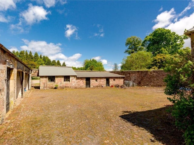 Courtyard consisting of garages, workshops and stables.