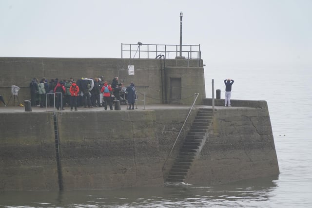 Actor Ed McVey, who plays the part of Prince William, filming scenes at the harbour in St Andrews, Scotland for the next season of The Crown. Picture date: Thursday March 16, 2023.