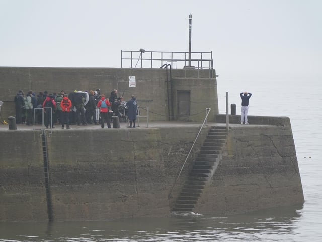 Actor Ed McVey, who plays the part of Prince William, filming scenes at the harbour in St Andrews, Scotland for the next season of The Crown. Picture date: Thursday March 16, 2023.