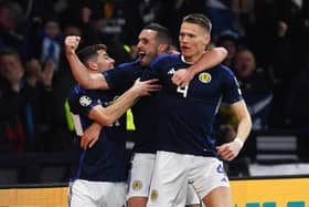 Scotland's John McGinn congratulates team-mate Scott McTominay he opens the scoring for Scotland against Spain, at Hampden, in March. Photo by Craig Foy / SNS Group
