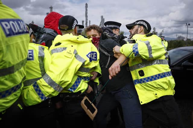 An activist tangles with police in a day of action near to the Grangemouth INEOS Oil Refinery in Bo'ness. Picture: Jeff J Mitchell/Getty Images