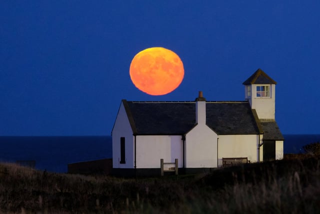 The Hunter's Moon rising above the Watch House Museum in Seaton Sluice