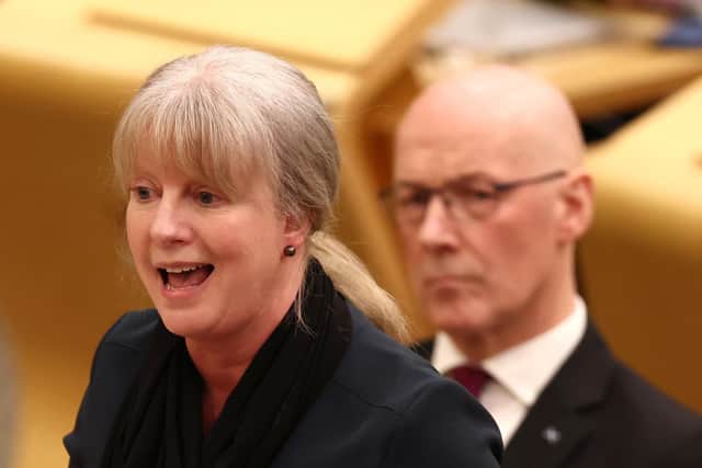 First Minister John Swinney looks on as Finance Minister Shona Robison presents the budget (Photo by Jeff J Mitchell/Getty Images)