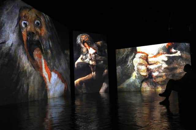 Images of paintings by Spanish painter Francisco de Goya displayed on video screens at the Fernan Gomez Centro Cultural de la Villa in Madrid (Picture: Gabriel Bouys/AFP via Getty Images)